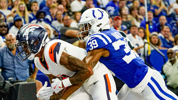 Indianapolis Colts cornerback Darrell Baker Jr. (39) disrupts a end zone catch by Denver Broncos wide receiver Josh Reynolds (11) during a pre-season game between the Indianapolis Colts and the Denver Broncos on Sunday, August. 11, 2024 at Lucas Oil Stadium in Indianapolis.