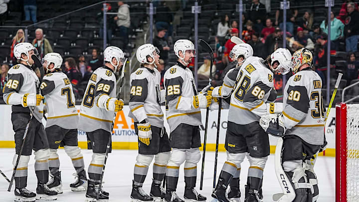 Henderson Silver Knights players line up to celebrate a win with goalie Carl Lindbom after their game at Acrisure Arena in Palm Desert, Calif., Wednesday, April 8, 2026.