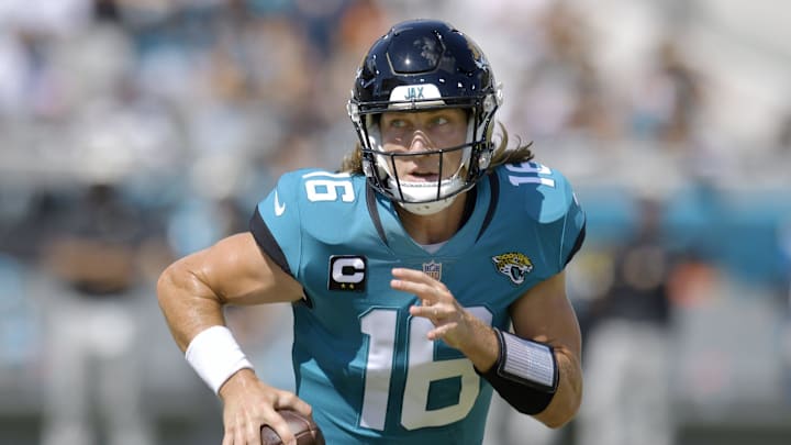 Jacksonville Jaguars quarterback Trevor Lawrence (16) scrambles during first quarter action. The