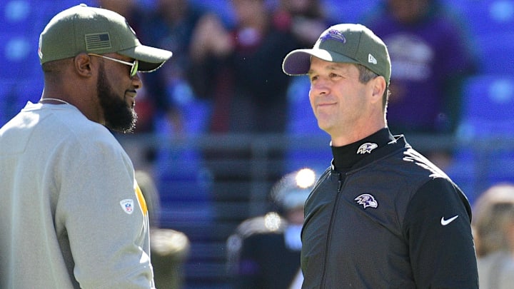 Pittsburgh Steelers head coach Mike Tomlin and Baltimore Ravens head coach John Harbaugh meet up on the field before their matchup in Baltimore.