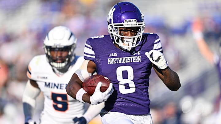 Sep 9, 2023; Evanston, Illinois, USA;  Northwestern Wildcats wide receiver A.J. Henning (8) scores