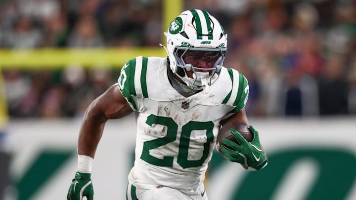 Oct 14, 2024; East Rutherford, New Jersey, USA; New York Jets running back Breece Hall (20) runs with the ball against the Buffalo Bills during the first half at MetLife Stadium. Mandatory Credit: Ed Mulholland-Imagn Images