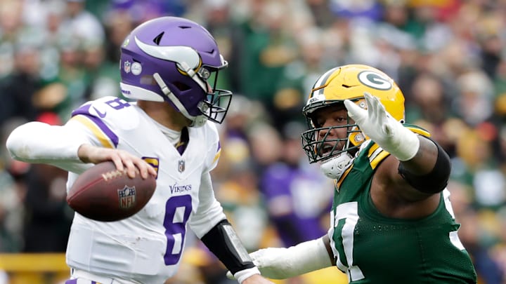 Green Bay Packers defensive tackle Kenny Clark (97) pressures Minnesota Vikings quarterback Kirk