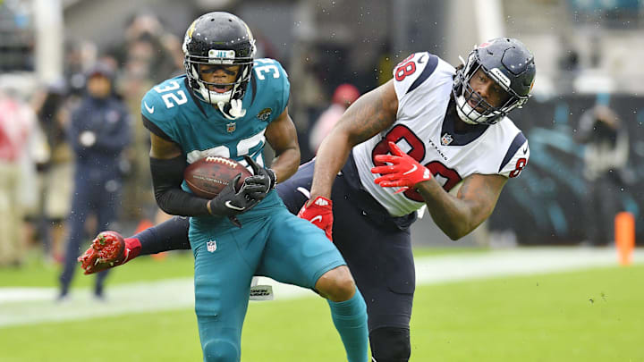 Jacksonville Jaguars cornerback Tyson Campbell (32) intercepts a pass intended for Houston Texans tight end Jordan Akins (88) during fourth quarter action. 