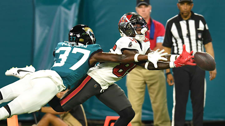 Jacksonville Jaguars cornerback Tre Flowers (37) helps prevent a potential touchdown pass to Tampa Bay Buccaneers wide receiver Latreal Jones (85) during fourth quarter action. The Jacksonville Jaguars hosted the Tampa Bay Buccaneers at EverBank Stadium for the Jaguars second preseason game of the season Saturday, August 17, 2024. 