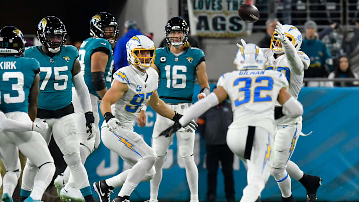 Jacksonville Jaguars quarterback Trevor Lawrence (16) watches as Los Angeles Chargers linebacker