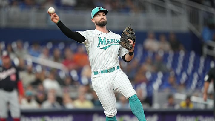 Aug 25, 2023; Miami, Florida, USA; Miami Marlins shortstop Jon Berti (5) throws out Washington Nationals first baseman Joey Meneses in the first inning at loanDepot Park. Mandatory Credit: Jim Rassol-Imagn Images