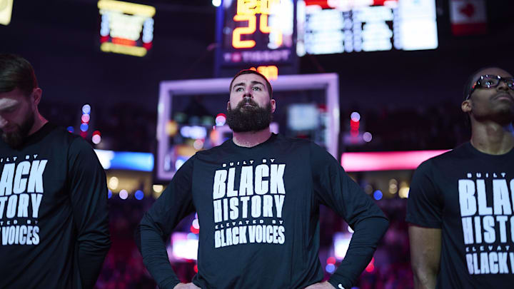 Feb 6, 2025; Portland, Oregon, USA; Sacramento Kings center Jonas Valanciunas (17) stands during the singing of the national anthem before a game against the Portland Trail Blazers at Moda Center. Mandatory Credit: Troy Wayrynen-Imagn Images