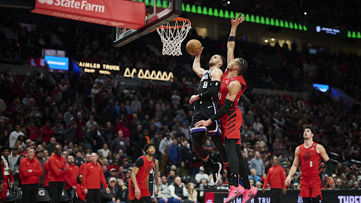 Feb 6, 2025; Portland, Oregon, USA; Sacramento Kings guard Zach LaVine (8) dunks the basketball during the second half against Portland Trail Blazers forward Toumani Camara (33) at Moda Center. Mandatory Credit: Troy Wayrynen-Imagn Images
