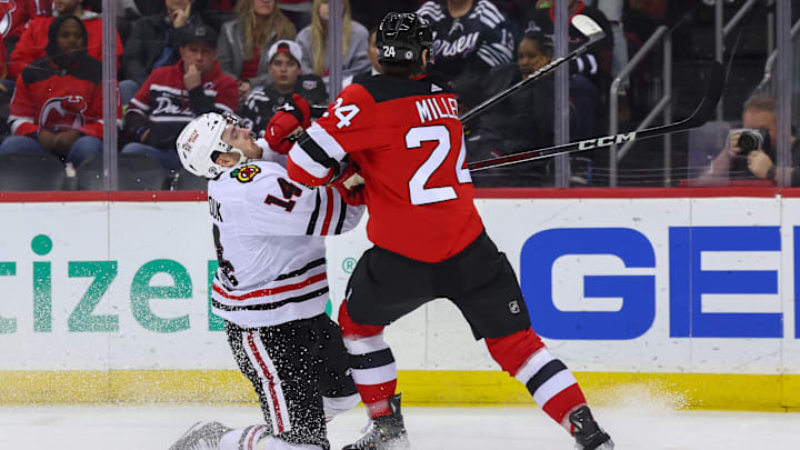 Jan 5, 2024; Newark, New Jersey, USA; New Jersey Devils defenseman Colin Miller (24) hits Chicago