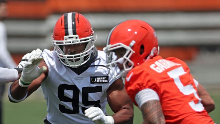 Browns defensive end Myles Garrett closes in on quarterback Dillon Gabriel during practice at minicamp, Tuesday, June 10, 2025, in Berea.