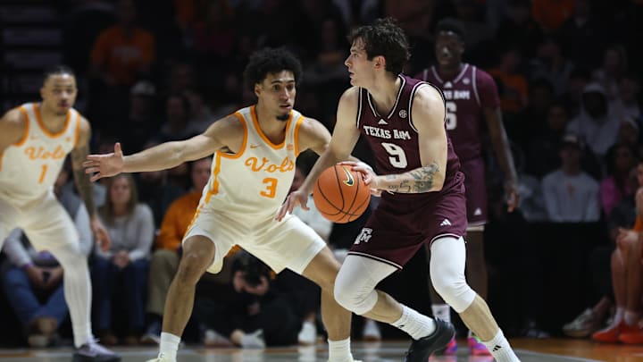 Jan 13, 2026; Knoxville, Tennessee, USA;  Texas A&M Aggies guard Ruben Dominguez (9) dribbles against Tennessee Volunteers guard Bishop Boswell (3) during the first half at Thompson-Boling Arena at Food City Center. Mandatory Credit: Randy Sartin-Imagn Images