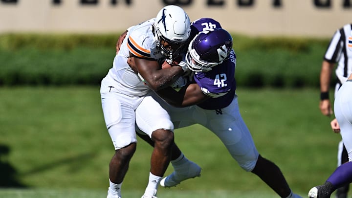 University of Texas El Paso Miners running back Deion Hankins (3) is tackled by Northwestern Wildcats defensive lineman Anto Saka (42) in the first half at Ryan Field. University of Texas El Paso Miners running back Deion Hankins (3) is tackled by Northwestern Wildcats defensive lineman Anto Saka (42) in the first half at Ryan Field.