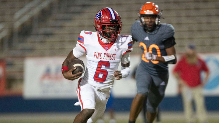 Pine Forest running back Zion Legree (No. 6) slips past the Escambia defense during their district battle.