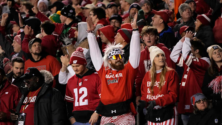 Oct 28, 2023; Madison, Wisconsin, USA; Wisconsin Badgers fans celebrate a touchdown during the second half of the NCAA football game against the Ohio State Buckeyes at Camp Randall Stadium. 