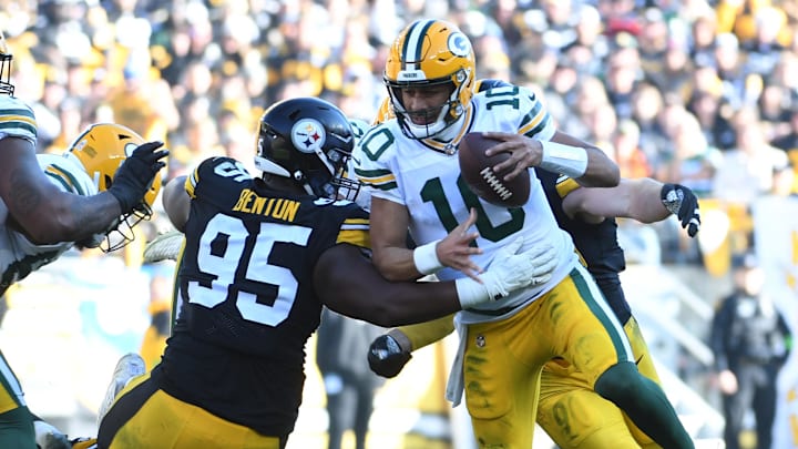 Nov 12, 2023; Pittsburgh, Pennsylvania, USA; Green Bay Packers quarterback Jordan Love (10) gets sacked by Pittsburgh Steelers linebacker T.J. Watt (90) as defensive tackle Keeanu Benton (95) gets a hand on him during the second quarter at Acrisure Stadium.