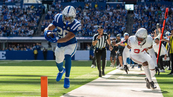Former Wisconsin Badgers running back Jonathan Taylor (28) reaches for the pylon Sunday, Oct. 12, 2025, against the Arizona Cardinals at Lucas Oil Stadium in Indianapolis.