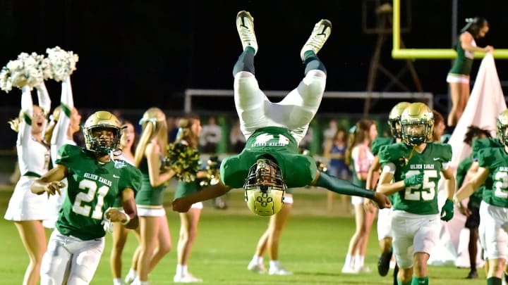 Fleming Island Golden Eagles Jarius Rodgers (14) does a flip as he runs out on the field with teammates before the start of the game against the Bartram Trail Bears. Fleming Island played host to Bartram Trail for Friday night football, September 29, 2023.