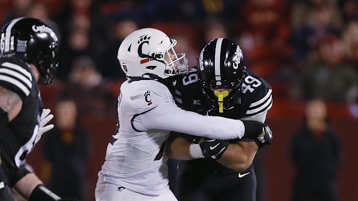 Iowa State Cyclones tight end Stevo Klotz (49)battle for few yard as Cincinnati Bearcats' linebacker Jonathan Thompson (22) takes down during the first quarter in the week-12 NCAA football at Jack Trice Stadium on Saturday, Nov. 16, 2024, in Ames, Iowa.