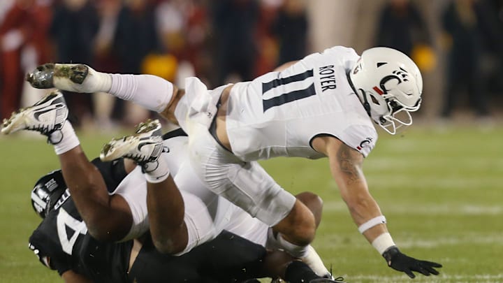 Cincinnati Bearcats' tight end Joe Royer (11) gets tackle by Iowa State Cyclones linebacker Jacob Ellis (44) during the third quarter in the week-12 NCAA football at Jack Trice Stadium on Saturday, Nov. 16, 2024, in Ames, Iowa. Cincinnati Bearcats' tight end Joe Royer (11) gets tackle by Iowa State Cyclones linebacker Jacob Ellis (44) during the third quarter in the week-12 NCAA football at Jack Trice Stadium on Saturday, Nov. 16, 2024, in Ames, Iowa.