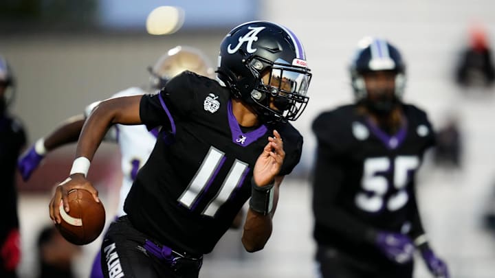 Sep 15, 2023; Columbus, Ohio, USA; Africentric quarterback Joshua Smith (11) scrambles during the high school football game against Briggs at Africentric Early College. Sep 15, 2023; Columbus, Ohio, USA; Africentric quarterback Joshua Smith (11) scrambles during the high school football game against Briggs at Africentric Early College.