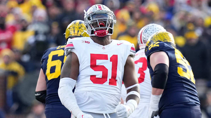Nov 25, 2023; Ann Arbor, Michigan, USA; Ohio State Buckeyes defensive tackle Michael Hall Jr. (51) celebrates a sack of Michigan Wolverines quarterback J.J. McCarthy (9) during the first half of the NCAA football game at Michigan Stadium. Nov 25, 2023; Ann Arbor, Michigan, USA; Ohio State Buckeyes defensive tackle Michael Hall Jr. (51) celebrates a sack of Michigan Wolverines quarterback J.J. McCarthy (9) during the first half of the NCAA football game at Michigan Stadium.