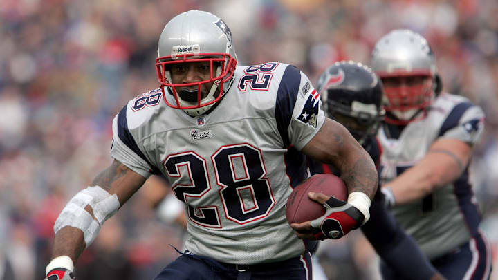 Dec 17, 2006; Foxborough, MA, USA;  New England Patriots running back (28) Corey Dillon runs the ball in the 1st quarter against the Houston Texans at Gillette Stadium. Mandatory Credit: David Butler II-Imagn Images Copyright © David Butler II




