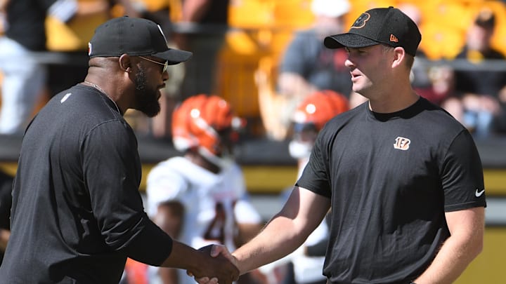 Sep 26, 2021; Pittsburgh, Pennsylvania, USA;  Pittsburgh Steelers head coach Mike Tomlin (left) meets with Cincinnati Bengals head coach Zac Taylor before their teams play each other at Heinz Field. Mandatory Credit: Philip G. Pavely-Imagn Images