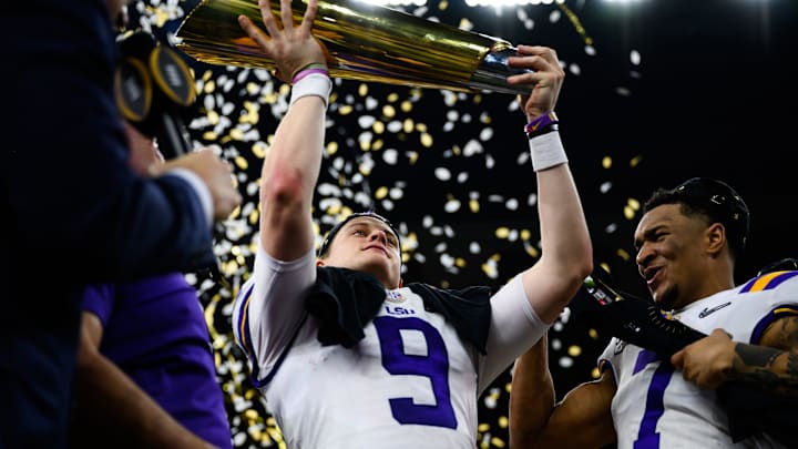 LSU quarterback Joe Burrow (9) holds up the trophy after their victory against Clemson at the College Football National Championship game at the Mercedes Benz Superdome Monday, Jan. 13, 2020.

Jm Championship 011320 043