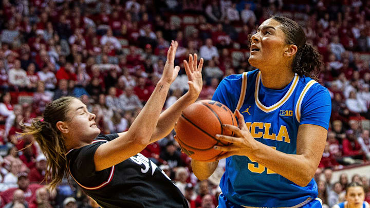 UCLA's Lauren Betts (51) shoots over Indiana's Lilly Meister (52) during the Indiana versus UCLA women's game at Simon Skjodt Assembly Hall on Saturday, Jan. 4, 2025.