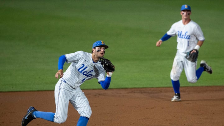 UCLA Bruins infielder Kyle Karros (44) grabs a bouncing ground ball as Auburn Tigers take on UCLA Bruins during the NCAA regional baseball tournament at Plainsman Park in Auburn, Ala., on Sunday, June 5, 2022.