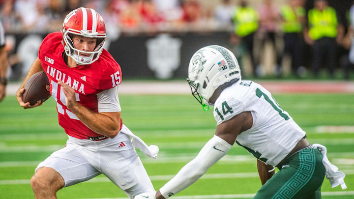 Indiana's Fernando Mendoza (15) runs during the Indiana versus Michigan State football game at Memorial Stadium on Saturday, Oct. 18, 2025.