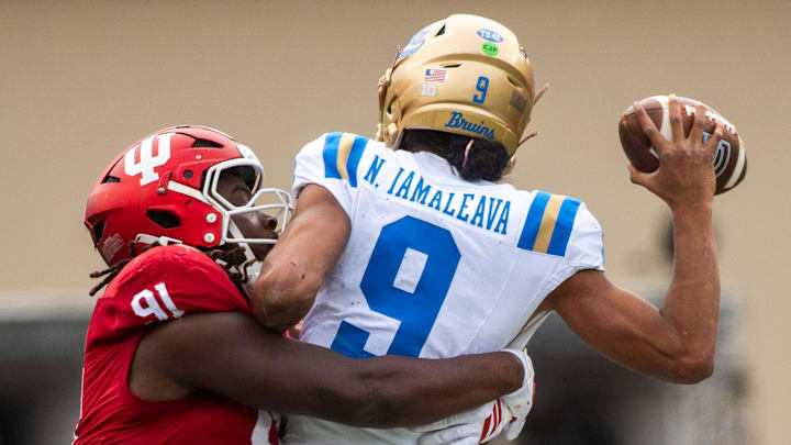 Indiana's Dominique Ratcliff (91) pressures UCLA's Nico Iamaleava (9) during the Indiana versus UCLA football game at Memorial Stadium on Saturday, Oct. 25, 2025. Indiana's Dominique Ratcliff (91) pressures UCLA's Nico Iamaleava (9) during the Indiana versus UCLA football game at Memorial Stadium on Saturday, Oct. 25, 2025.
