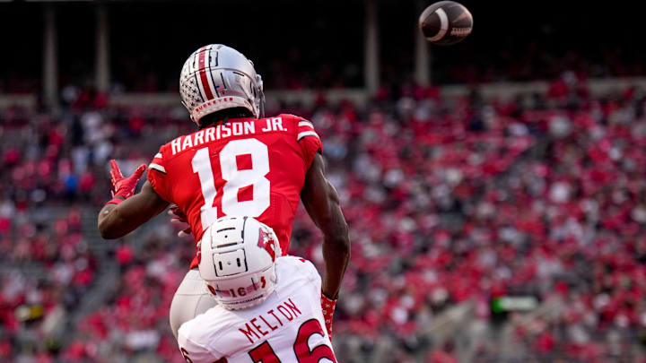 Ohio State Buckeyes wide receiver Marvin Harrison Jr. (18) is defended by Rutgers Scarlet Knights