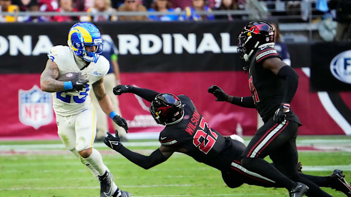 Nov 26, 2023; Glendale, AZ, USA; Los Angeles Rams running back Kyren Williams (23) pushes aside