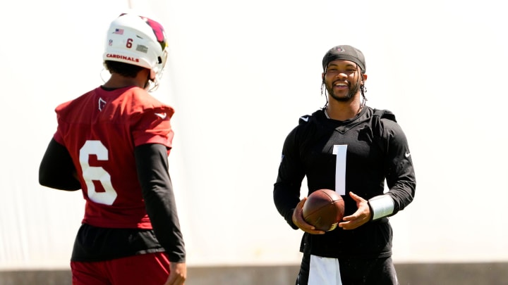 Arizona Cardinals quarterback Kyler Murray (1) talks to running back James Conner (6) during minicamp at Dignity Health Training Center on June 11, 2024.