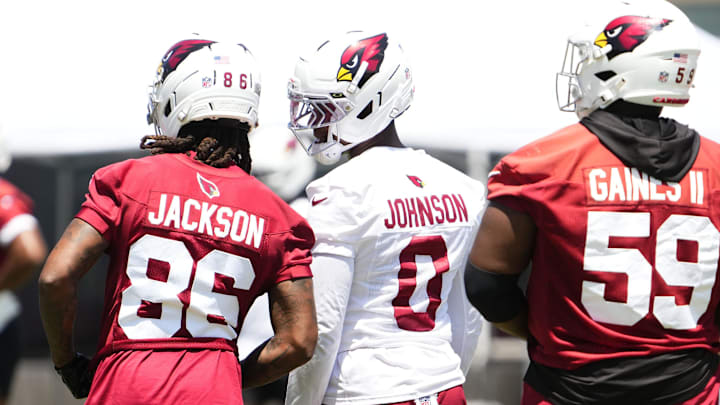Arizona Cardinals cornerback Will Johnson (0) talks to wide receiver Trishton Jackson (86) during organized team practice at the Arizona Cardinals training center in Tempe on June 3, 2025. Arizona Cardinals cornerback Will Johnson (0) talks to wide receiver Trishton Jackson (86) during organized team practice at the Arizona Cardinals training center in Tempe on June 3, 2025.