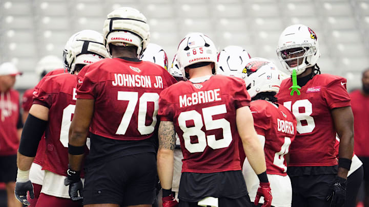 Arizona Cardinals offensive linemen Paris Johnson Jr. (70), tight end Trey McBride (85), and wide receiver Marvin Harrison Jr. (18) during training camp at State Farm Stadium in Glendale on July 25, 2025. Arizona Cardinals offensive linemen Paris Johnson Jr. (70), tight end Trey McBride (85), and wide receiver Marvin Harrison Jr. (18) during training camp at State Farm Stadium in Glendale on July 25, 2025.