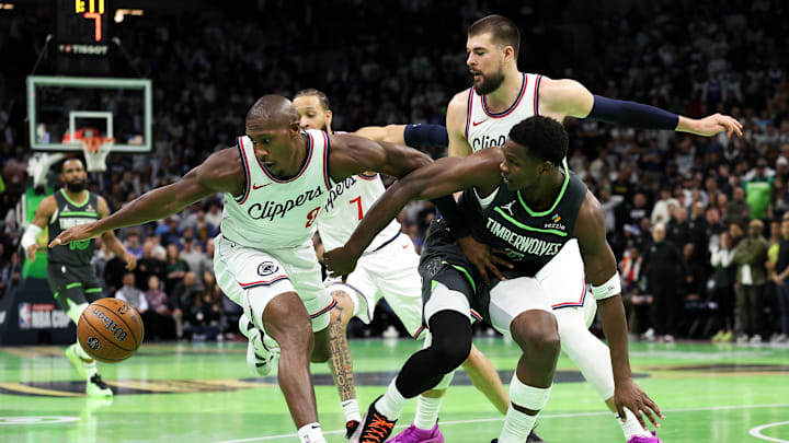 Nov 29, 2024; Minneapolis, Minnesota, USA; Minnesota Timberwolves guard Anthony Edwards (5) and LA Clippers guard Kris Dunn (8) compete for the ball during the second half of an NBA Cup game at Target Center. Mandatory Credit: Matt Krohn-Imagn Images Nov 29, 2024; Minneapolis, Minnesota, USA; Minnesota Timberwolves guard Anthony Edwards (5) and LA Clippers guard Kris Dunn (8) compete for the ball during the second half of an NBA Cup game at Target Center. Mandatory Credit: Matt Krohn-Imagn Images