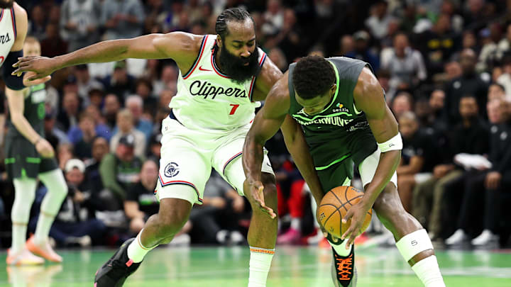 Minnesota Timberwolves guard Anthony Edwards (5) and LA Clippers guard James Harden (1) compete for the ball during the second half of an NBA Cup game at Target Center. Mandatory Credit: Matt Krohn-Imagn Images