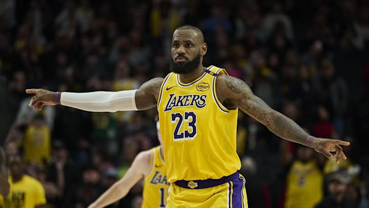 Feb 20, 2025; Portland, Oregon, USA; Los Angeles Lakers forward LeBron James (23) signals to teammates during the second half against the Portland Trail Blazers at Moda Center. Mandatory Credit: Troy Wayrynen-Imagn Images