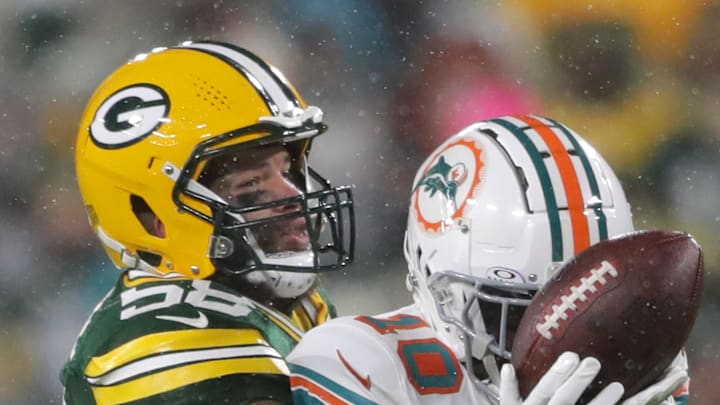 Green Bay Packers linebacker Isaiah McDuffie (58) against Miami Dolphins wide receiver Tyreek Hill (10) in the first half football game at Lambeau Field. Green Bay Packers linebacker Isaiah McDuffie (58) against Miami Dolphins wide receiver Tyreek Hill (10) in the first half football game at Lambeau Field.