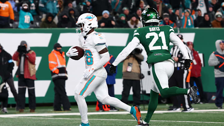 Miami Dolphins running back De'Von Achane (28) scores a touchdown during the fourth quarter of their game against the New York Jets at MetLife Stadium.