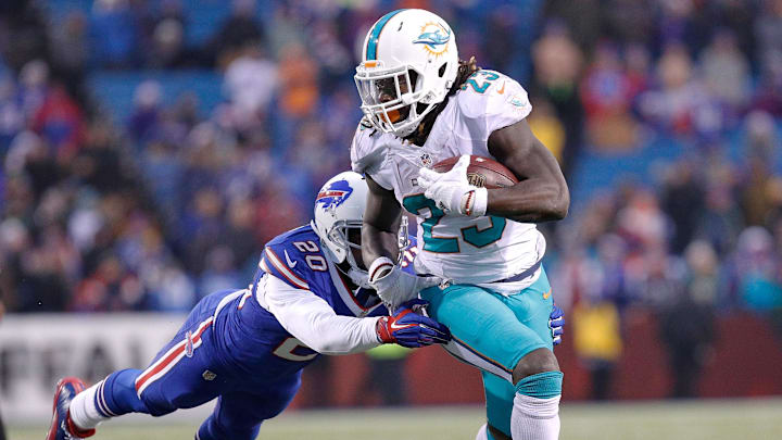 Miami Dolphins running back Jay Ajayi (23) and Buffalo Bills free safety Corey Graham (20) during the game at New Era Field in December 2016.