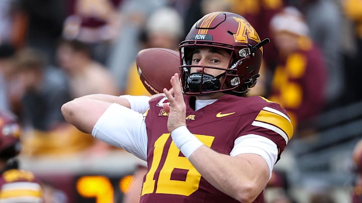 Nov 23, 2024; Minneapolis, Minnesota, USA; Minnesota Golden Gophers quarterback Max Brosmer (16) warms up before the game against the Penn State Nittany Lions at Huntington Bank Stadium. Mandatory Credit: Matt Krohn-Imagn Images