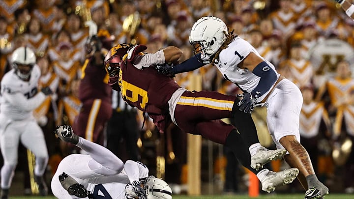 Nov 23, 2024; Minneapolis, Minnesota, USA; Minnesota Golden Gophers wide receiver Daniel Jackson (9) catches a pass as Penn State Nittany Lions safety Jaylen Reed (1) defends during the fourth quarter at Huntington Bank Stadium. Mandatory Credit: Matt Krohn-Imagn Images