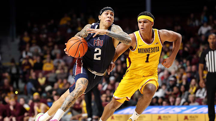 Dec 21, 2024; Minneapolis, Minnesota, USA; Fairleigh Dickinson Knights guard Terrence Brown (2) works around Minnesota Golden Gophers guard Isaac Asuma (1) during the second half at Williams Arena. Mandatory Credit: Matt Krohn-Imagn Images Dec 21, 2024; Minneapolis, Minnesota, USA; Fairleigh Dickinson Knights guard Terrence Brown (2) works around Minnesota Golden Gophers guard Isaac Asuma (1) during the second half at Williams Arena. Mandatory Credit: Matt Krohn-Imagn Images