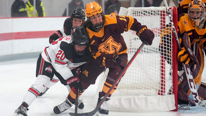 Oct 29, 2022; Columbus, Ohio, USA;  Ohio State University forward Makenna Webster (20) contests the puck with University of Minnesota forward Abbey Murphy (18) during the second period at Ohio State Ice Rink. Mandatory Credit: Joseph Scheller-The Columbus Dispatch

Hockey Osu Women Hockey