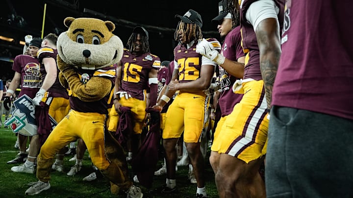 Minnesota players celebrate their win at the 2025 Rate Bowl at Chase Field on Dec. 26, 2025, in Phoenix.