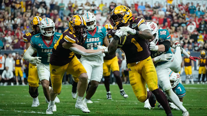 Darius Taylor (1) of the Minnesota Gophers weaves past New Mexico defense during the 2025 Rate Bowl at Chase Field on Dec. 26, 2025, in Phoenix. Darius Taylor (1) of the Minnesota Gophers weaves past New Mexico defense during the 2025 Rate Bowl at Chase Field on Dec. 26, 2025, in Phoenix.